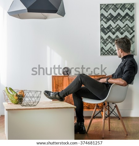 Elegant man in modern and fancy living room 