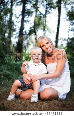 A portrait of a happy caucasian mother with her son outdoor