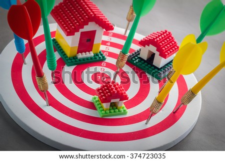 House on dartboard business concept