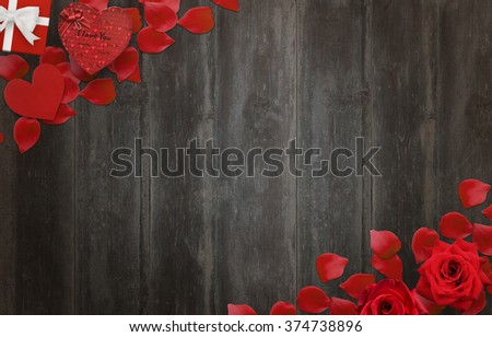Love background scene with free space for text. Petals, roses, gifts, heart on wooden background.