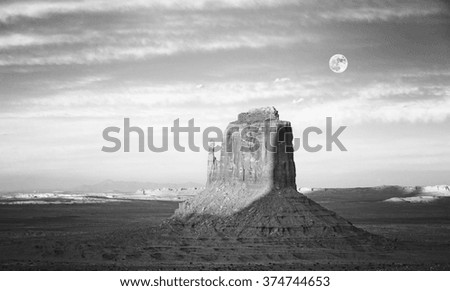 Black and white picture of rock formation in Monument Valley at sunset, USA