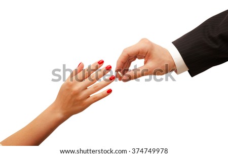 Man putting engagement ring on woman hand isolated. Romantic background with petals, roses, gifts on wooden table.