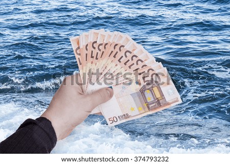 money in hand and water texture
