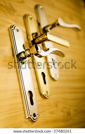 A series of golden handles on a wooden board 2