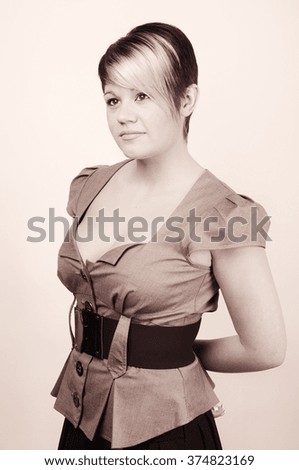 Pic Copper toned  Shot of a Confident Young Office Woman . Plain Wall with Copy Space