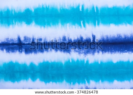 striped tie dye pattern on cotton fabric abstract background.
