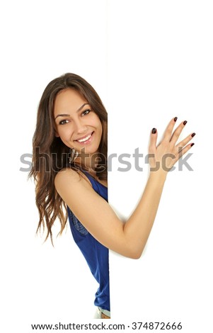 Young beautiful brunette woman holding a white blank paper on white background