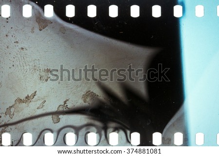 Blank noisy grungy scratched film strip texture background 