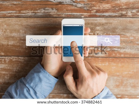 business, people, internet and technology concept - close up of male hands holding smartphone and pointing finger browser search bar
