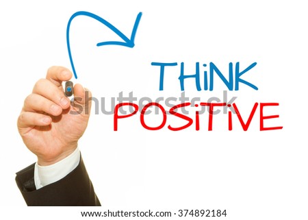 Businessman hand writing Think Positive with a marker on a transparent wipe board