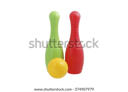 Red, green and yellow toy bowling ball. Isolated on white.