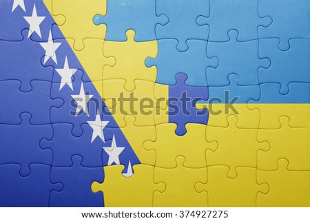 puzzle with the national flag of ukraine and bosnia and herzegovina . concept
