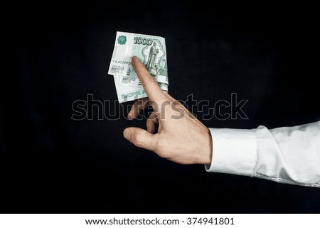 Man holding russian rubles banknotes. Financial theme. Horizontal view.