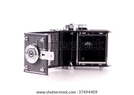 Antique medium format film mechanical camera isolated on white
