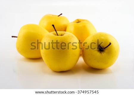 Yellow apples on the white background. Isolated