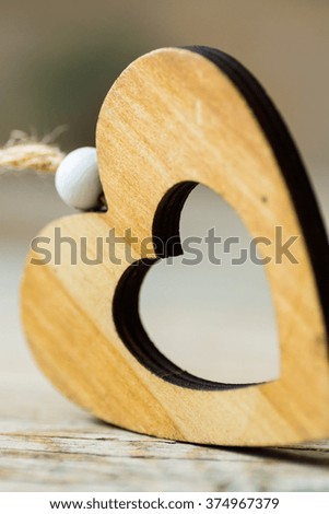 wooden heart on wooden background