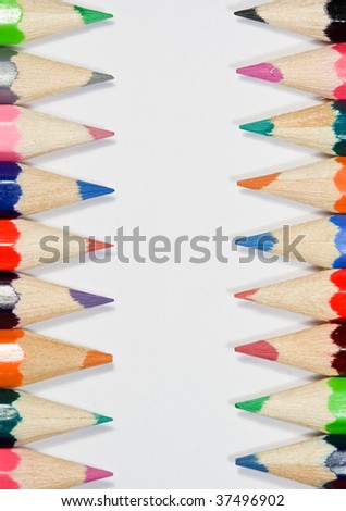 Row of colorful pencils on white background