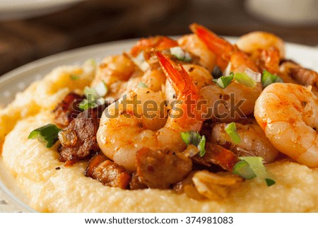 Homemade Shrimp and Grits with Pork and Cheddar Royalty-Free Stock Photo #374981083