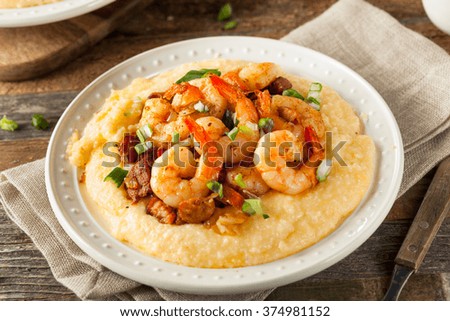 Homemade Shrimp and Grits with Pork and Cheddar Royalty-Free Stock Photo #374981152