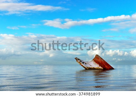 Ship wreck rusty landscape sinking into the sea Trinidad and Tobago  Royalty-Free Stock Photo #374981899