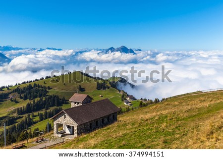 Stunning view on top of Rigi, with peak Pilatus and cloudscape in background, Canton of Lucerne, Switzerland.