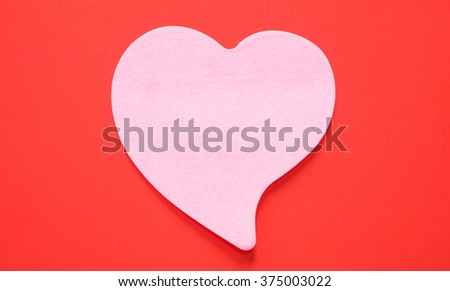 pink heart on red background