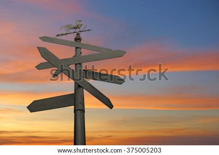direction sign with blank spaces for text on beautiful twilight background