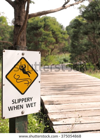 Sign "Slippery when wet"  in a park, Australia 2016