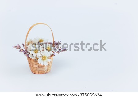Daisy flower in a basket, Soft focus and vintage tone background. 