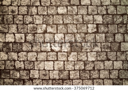 Paving blocks made of small tiles of regular shape