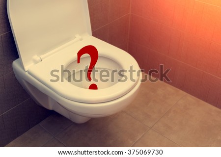 Toilet with sign question mark
