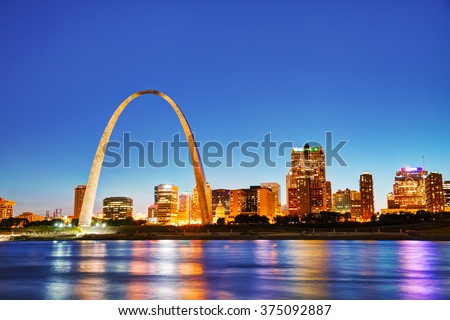 Downtown St Louis, MO with the Old Courthouse and the Gateway Arch at sunset Royalty-Free Stock Photo #375092887