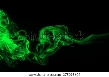 Green smoke black studio background