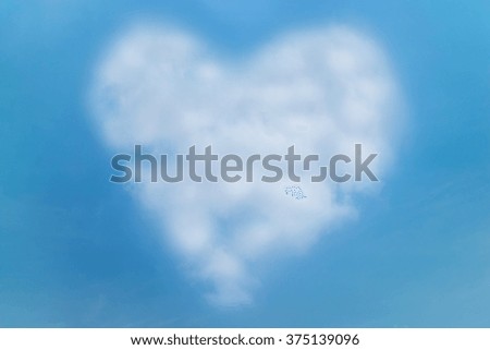 Heart shape cloud on blue sky