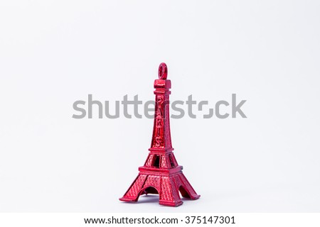 red eiffel tower toy on white background 