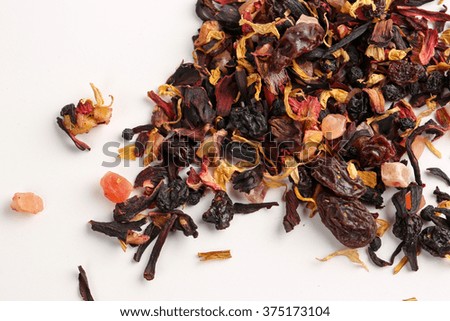 Still life, aromatic dry tea with fruits and petals, close up on white background, selective focus 