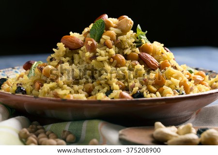 Traditional Middle Eastern or Indian dish of rice (pilaf) cooked with spices Royalty-Free Stock Photo #375208900