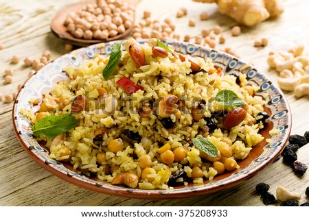 Traditional Middle Eastern or Indian dish of rice (pilaf) cooked with spices Royalty-Free Stock Photo #375208933