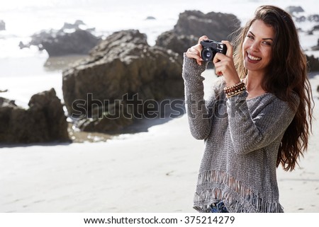 Hipster woman taking photos 