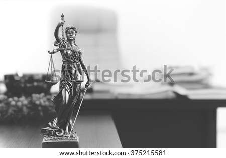 Themis statue in lawyer's office in black and white