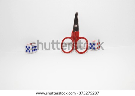 Cut Tax Concept with wooden block and scissor on stacked coins,isolated white