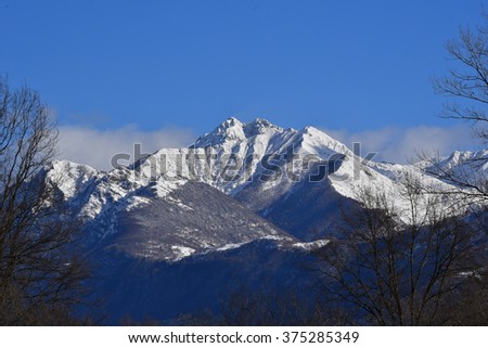 Panoramic view of mountain peaks with snow