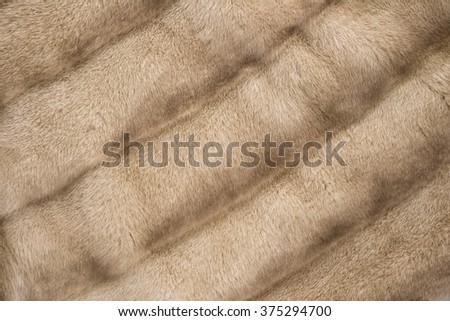 Brown mink fur coat texture background