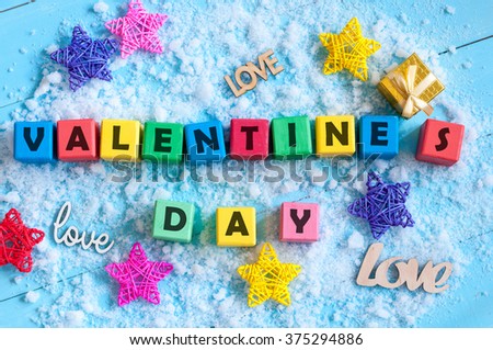 Valentines Day background with tiy cubes, srar and gift. Love, wedding concept