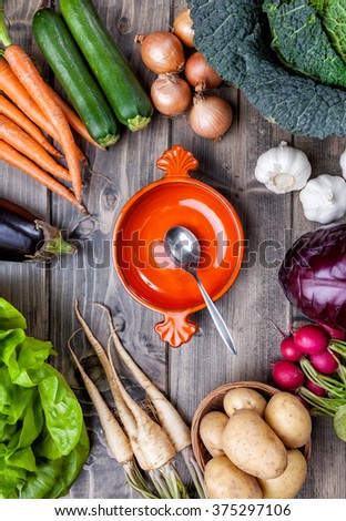 Fresh and organic bio vegetables on a wooden background