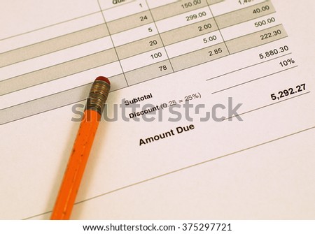 Invoice and vintage pencil