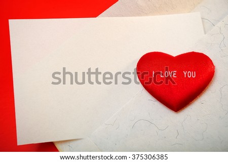Valentine's day. Holiday Card. Red heart with the inscription "I love you" on red cardboard envelope and empty letter