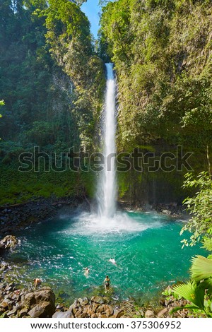 La Fortuna Waterfall, Waterfall with emerald pool in rainforest - Catarata Rio Fortuna, La Fortuna, Alajuela province, Costa Rica, Central America Royalty-Free Stock Photo #375306952
