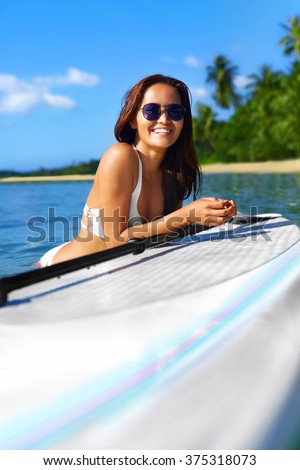 Summer Holidays. Close Up Of Happy Smiling Young Woman In Bikini On Surfing, Surf Board In Sea. Travel Vacation To Exotic Resort. Fun And Happiness. Healthy Lifestyle. Water Sports. Beauty, Recreation