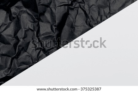 Crumpled black and white paper horizontally